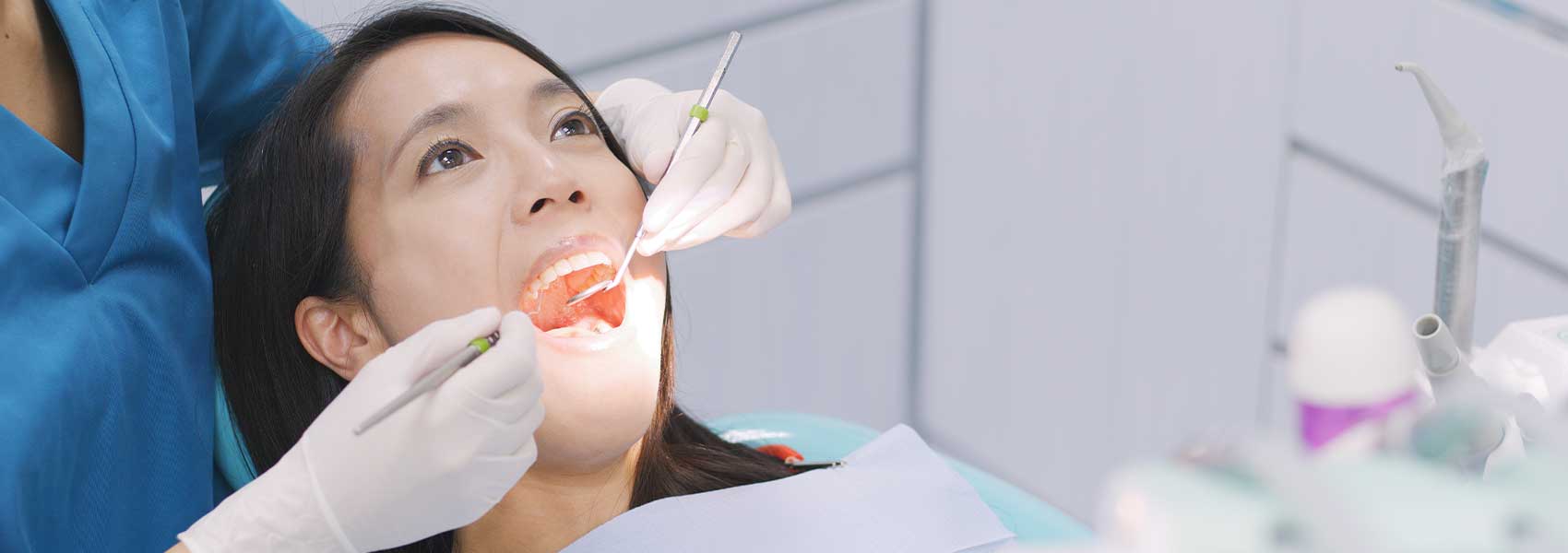 Dentist perform treatments for root canal planing