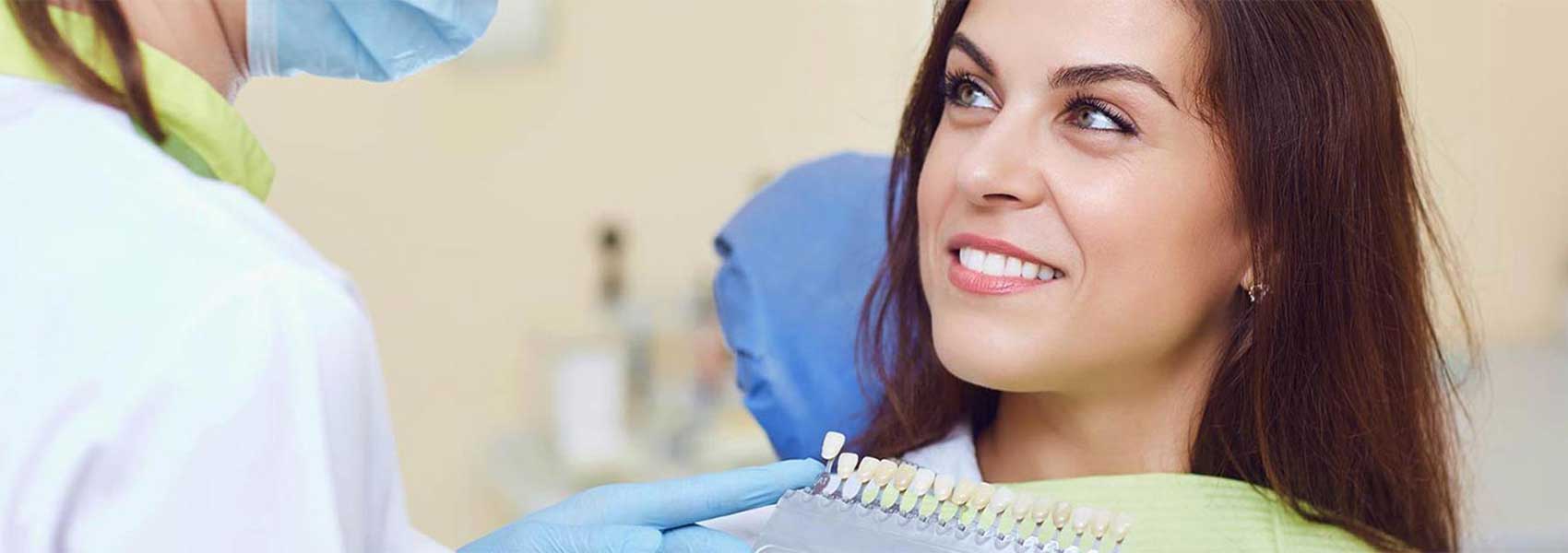 Beautiful woman smiling at dental